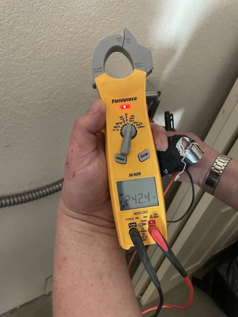 Voltage testing with clamp meter during Outlet Installation in Stanwood